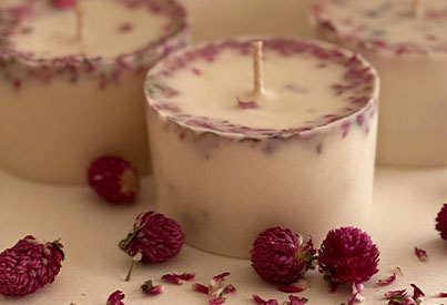  pink and white candle with rass berry around it 