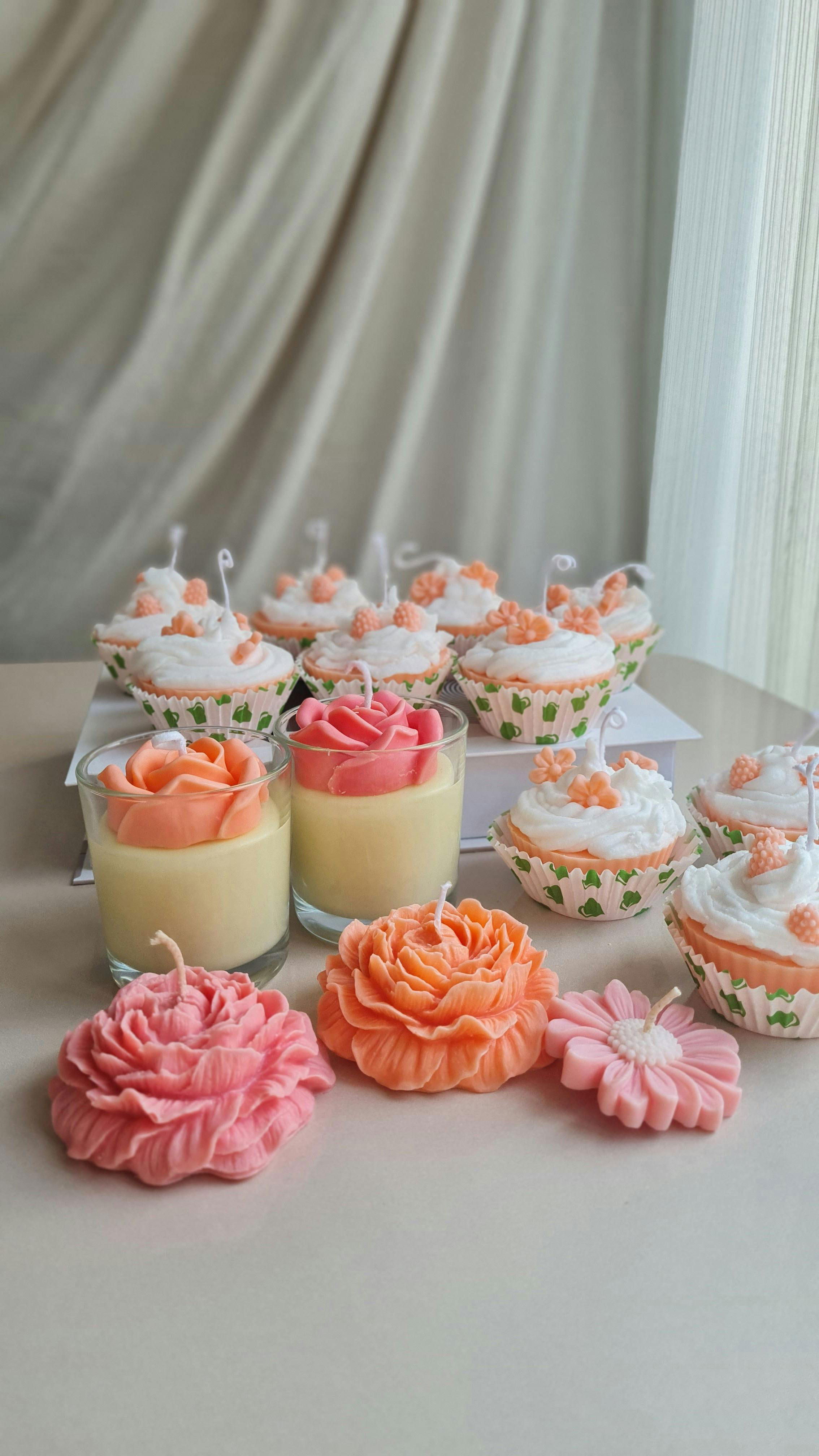  this image shows the showimg candles in the shape of cupcakes 