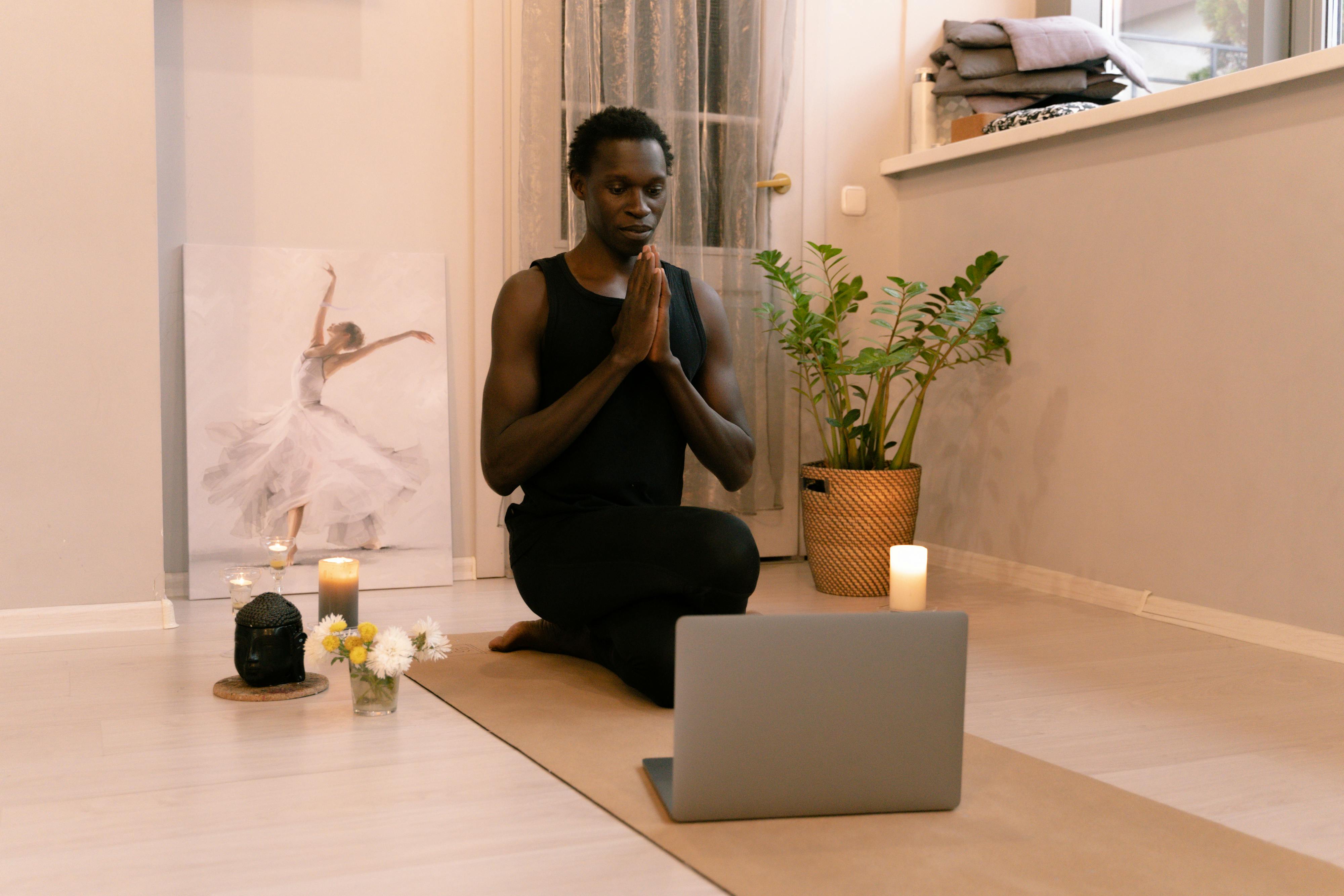 image of a man doing yoga practcing self care