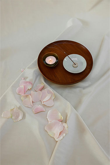  two different candles in a meditation plate for relaxation